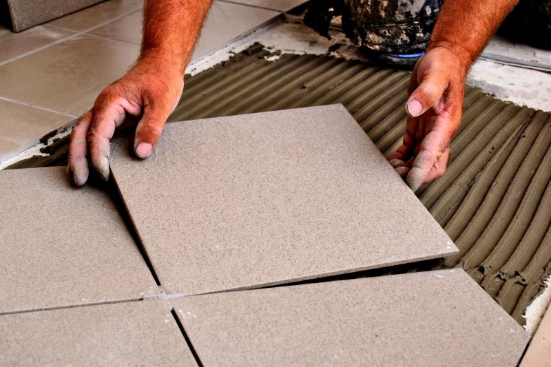 Floor tile being laid in a kitchen